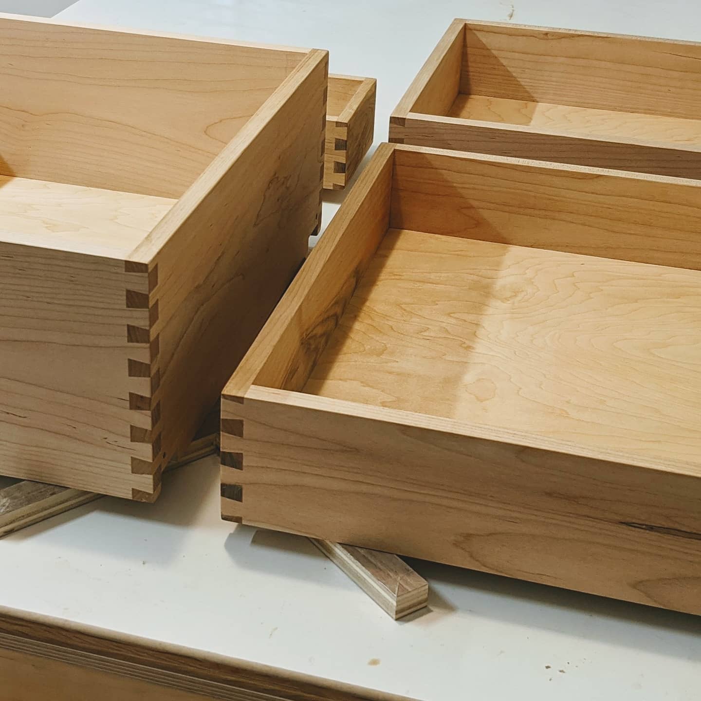 October 27th, 2020: Today, we took the completed dovetailed drawer boxes and finished them with shellac. Two more coats and they'll be ready for delivery!